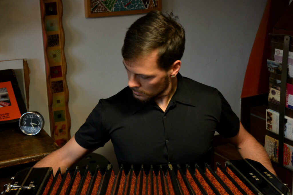 Omar Caccia, bandoneon player, playing in a studio.